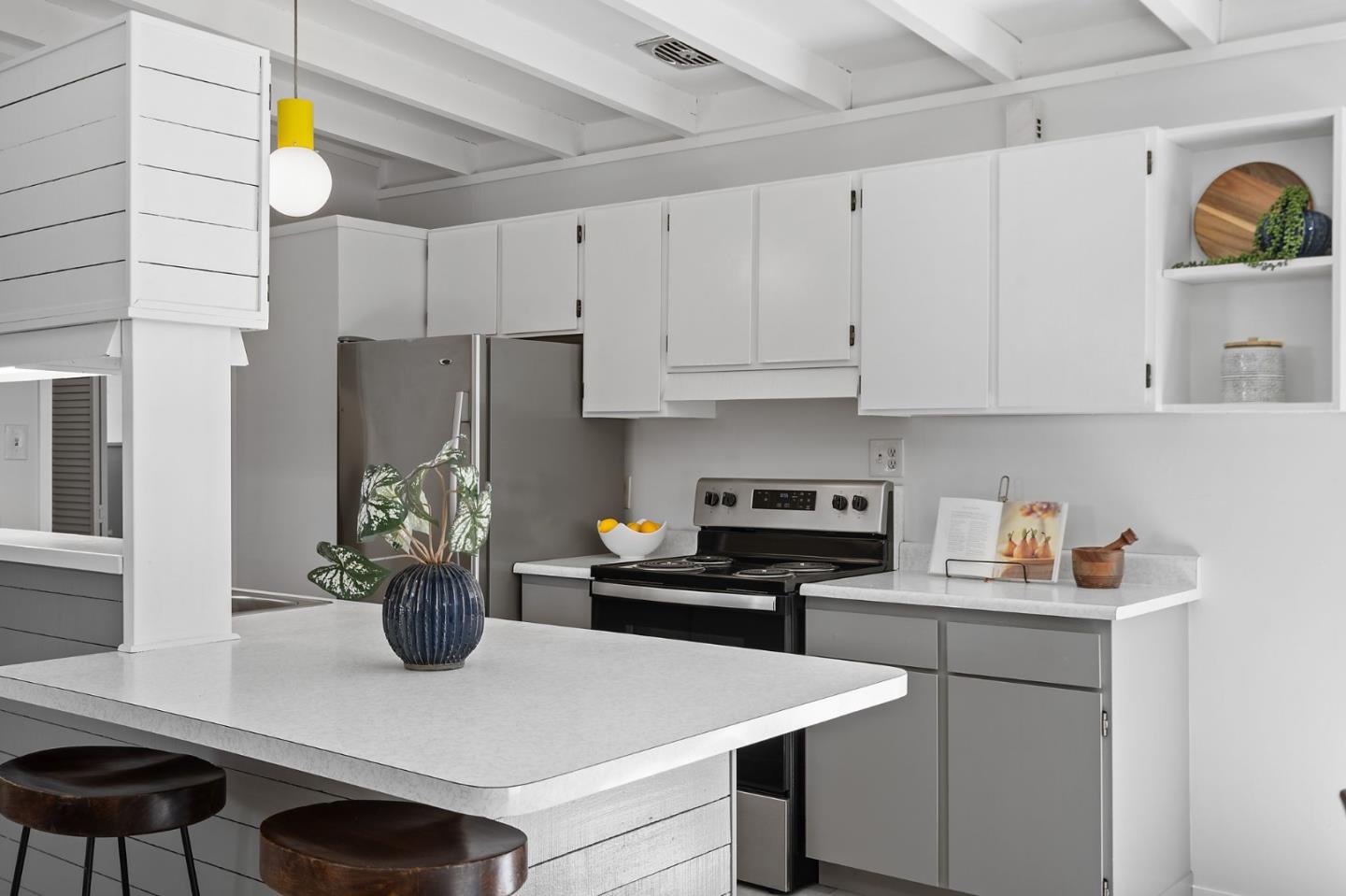 2409 Laura Lane Mountain View, CA 94043 - Photo 12 of 26 a kitchen with a sink a stove and white cabinets