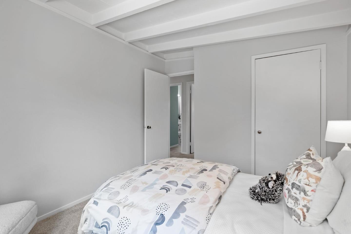 2409 Laura Lane Mountain View, CA 94043 - Photo 16 of 26 a bedroom with a bed and a mirror