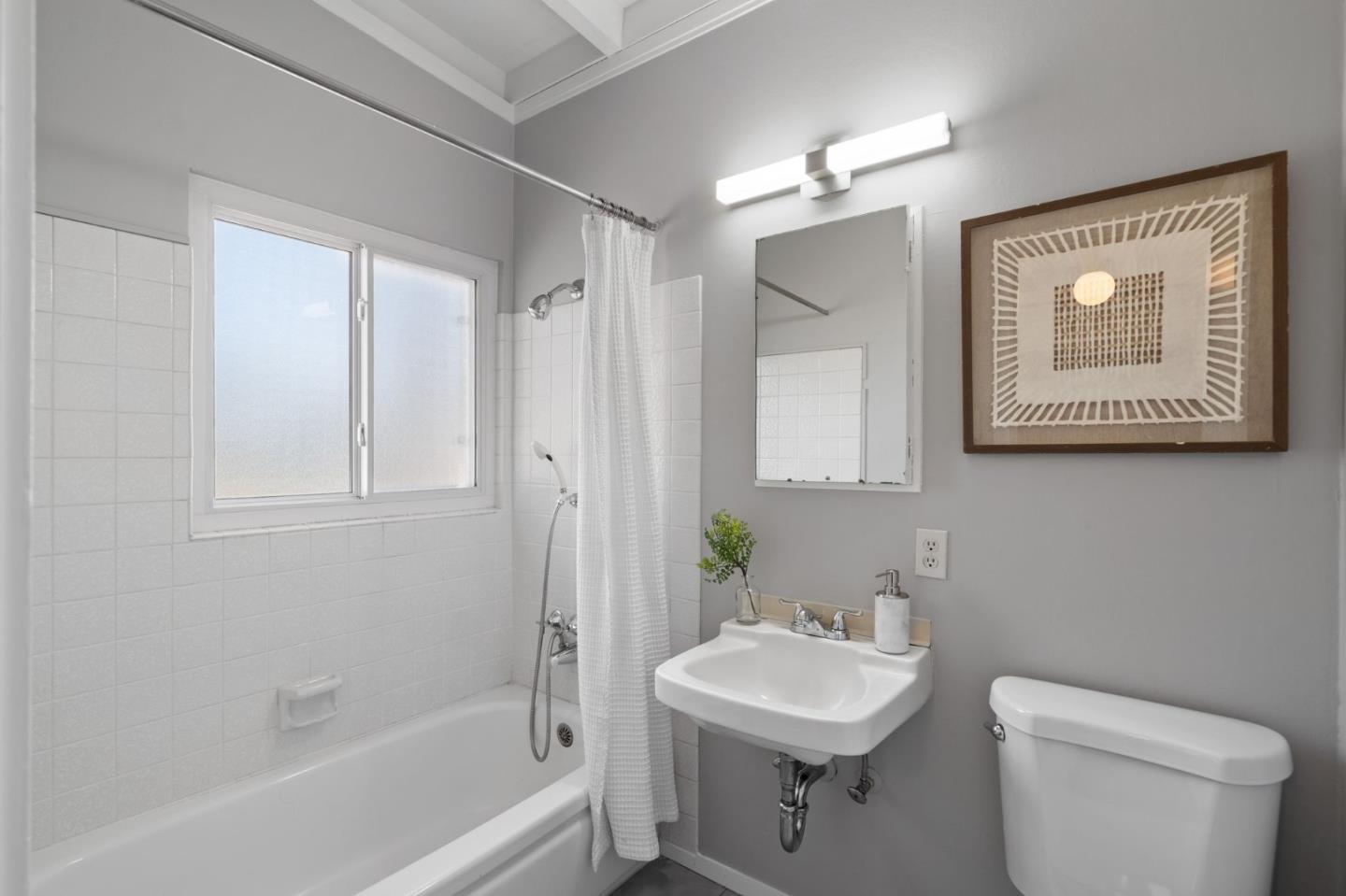2409 Laura Lane Mountain View, CA 94043 - Photo 19 of 26 a bathroom with a toilet a sink and mirror