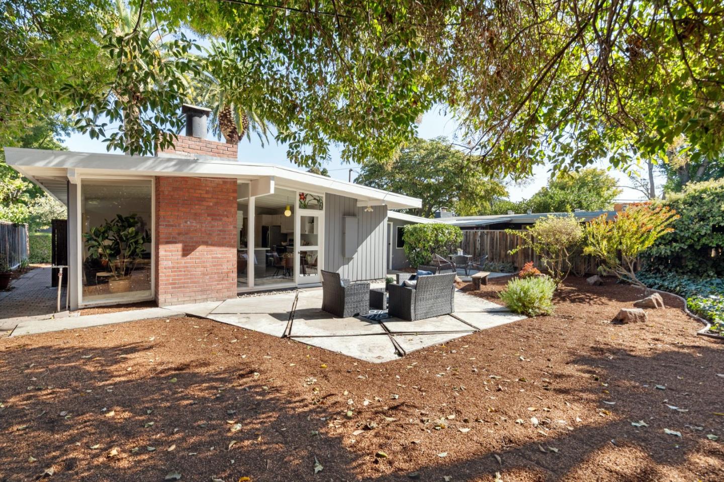 2409 Laura Lane Mountain View, CA 94043 - Photo 23 of 26 a view of a house with backyard porch and sitting area
