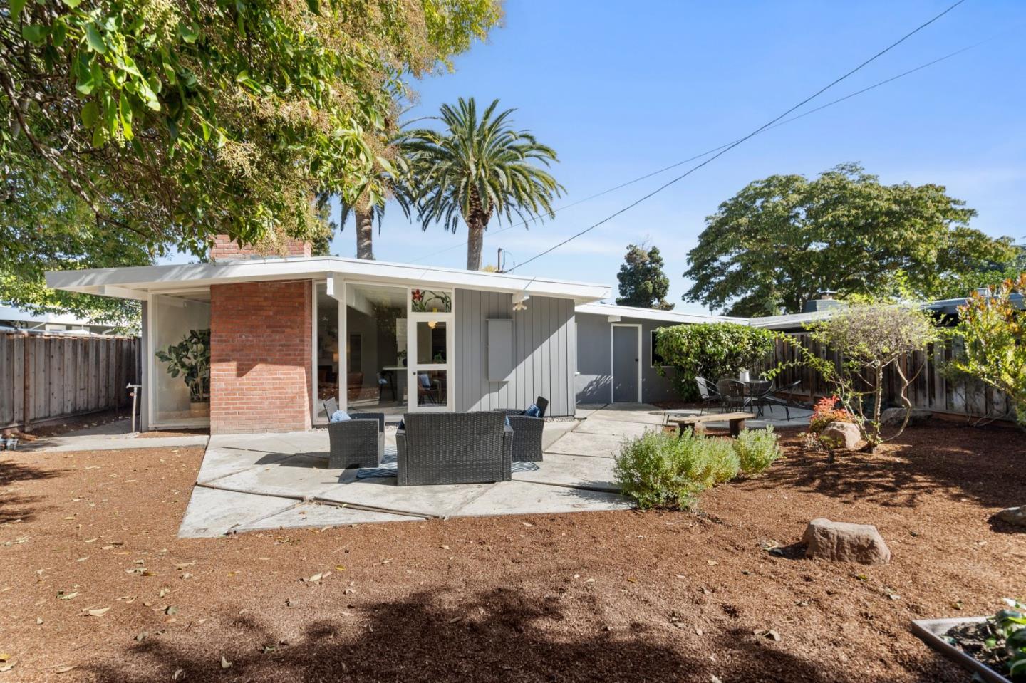 2409 Laura Lane Mountain View, CA 94043 - Photo 24 of 26 a front view of a house with garden and parking
