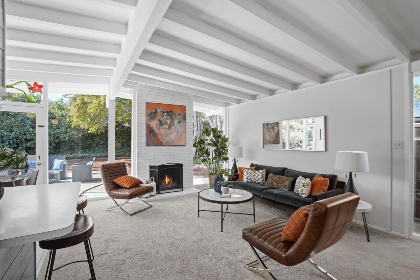 2409 Laura Lane Mountain View, CA 94043 - Photo 6 of 26 a living room with furniture a fireplace and a potted plant