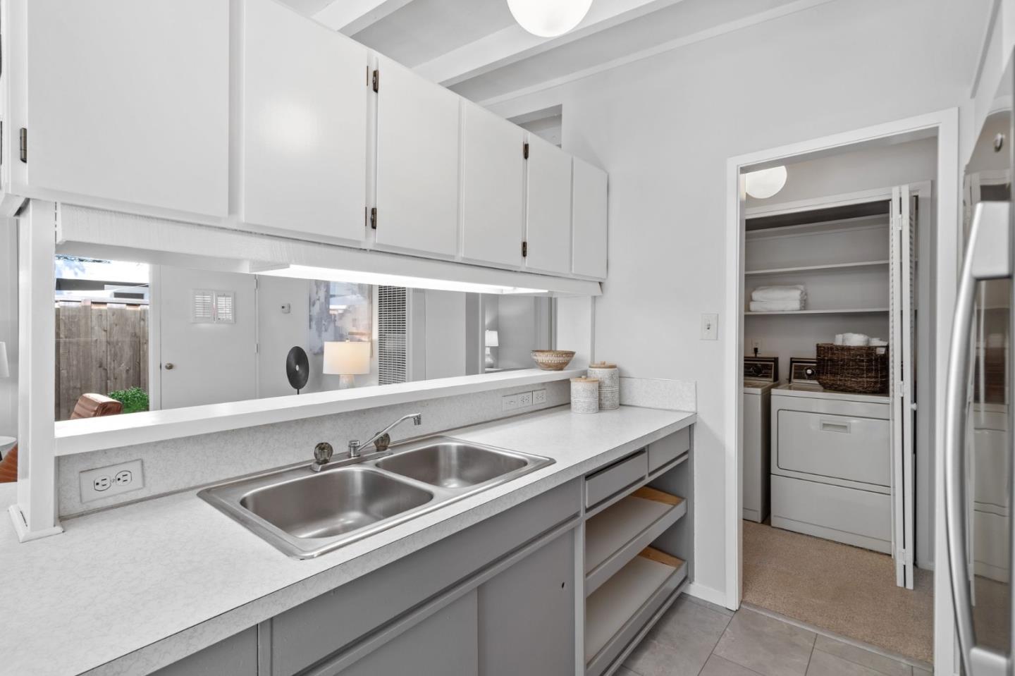 2409 Laura Lane Mountain View, CA 94043 - Photo 10 of 26 a kitchen with a sink and cabinets