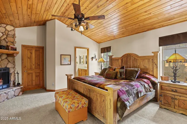 a bedroom with a bed couch and dresser