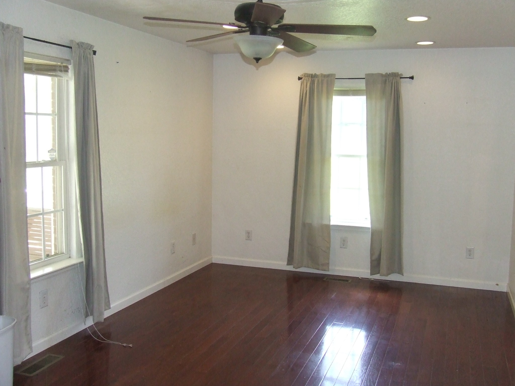 60 Sneed Road McMinnville, TN 37110 - Photo 19 of 30 an empty room with wooden floor fan and windows