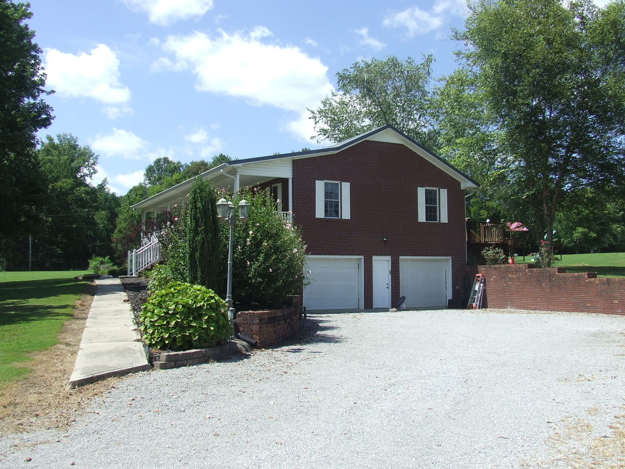 60 Sneed Road McMinnville, TN 37110 - Photo 2 of 30 a front view of a house with a yard and garage
