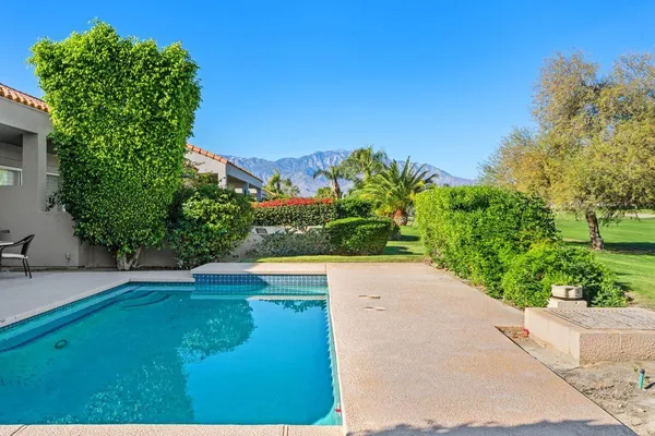 a view of a back yard of the house