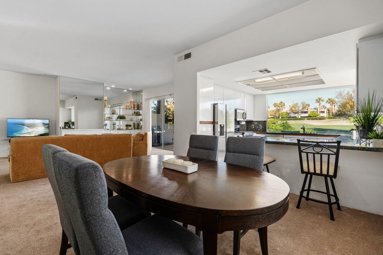 6 Pebble Beach Drive Rancho Mirage, CA 92270 - Photo 12 of 46 a view of a dining room with furniture and wooden floor
