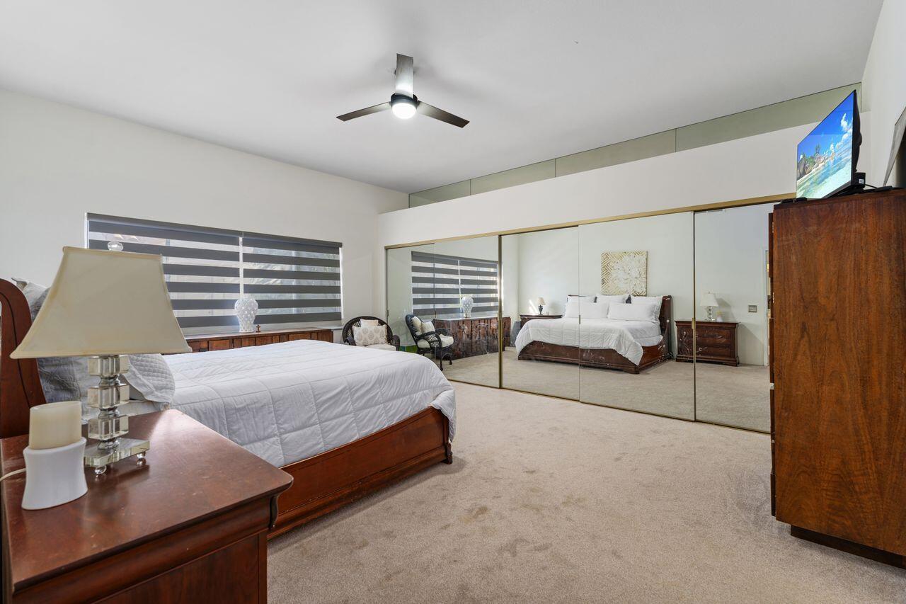 6 Pebble Beach Drive Rancho Mirage, CA 92270 - Photo 13 of 44 a living room with furniture and a window