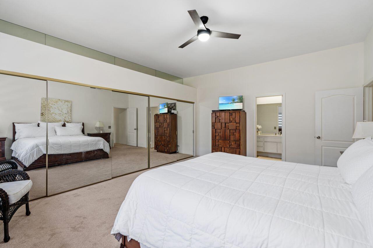 6 Pebble Beach Drive Rancho Mirage, CA 92270 - Photo 15 of 44 a bedroom with a bed and closet