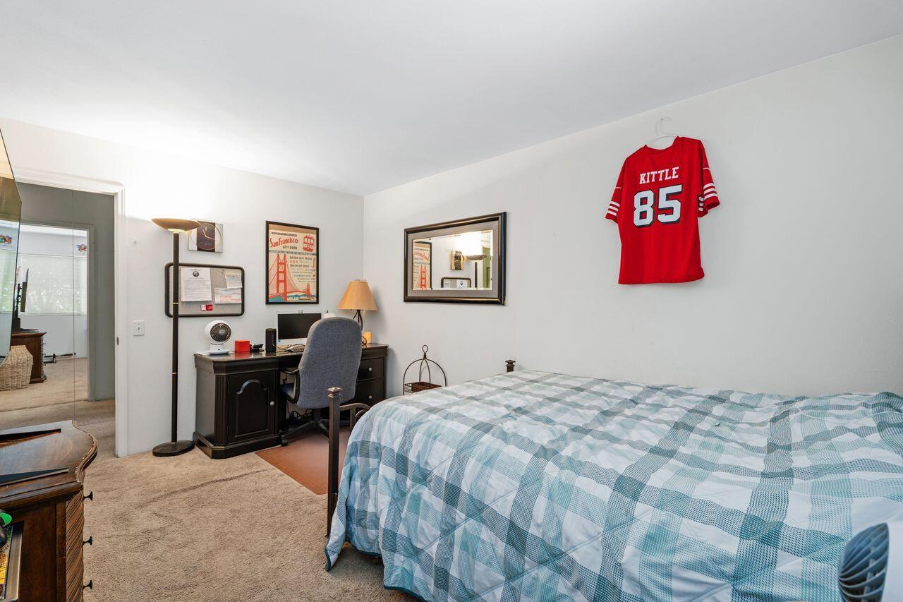 6 Pebble Beach Drive Rancho Mirage, CA 92270 - Photo 19 of 44 a bedroom with a bed and cabinets