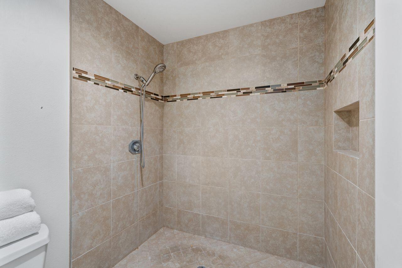 6 Pebble Beach Drive Rancho Mirage, CA 92270 - Photo 20 of 46 a bathroom with a shower