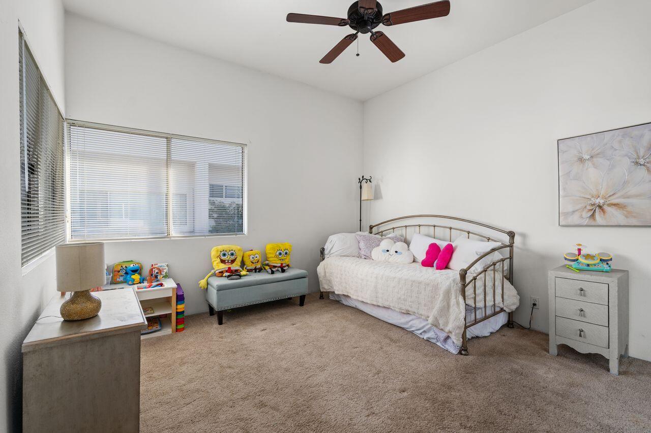 6 Pebble Beach Drive Rancho Mirage, CA 92270 - Photo 20 of 44 a living room with furniture and a baby crib