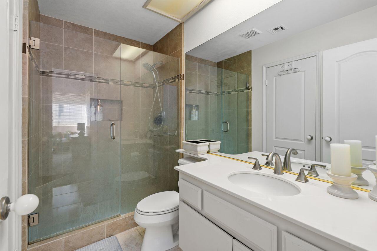 6 Pebble Beach Drive Rancho Mirage, CA 92270 - Photo 21 of 44 a bathroom with a sink toilet and shower