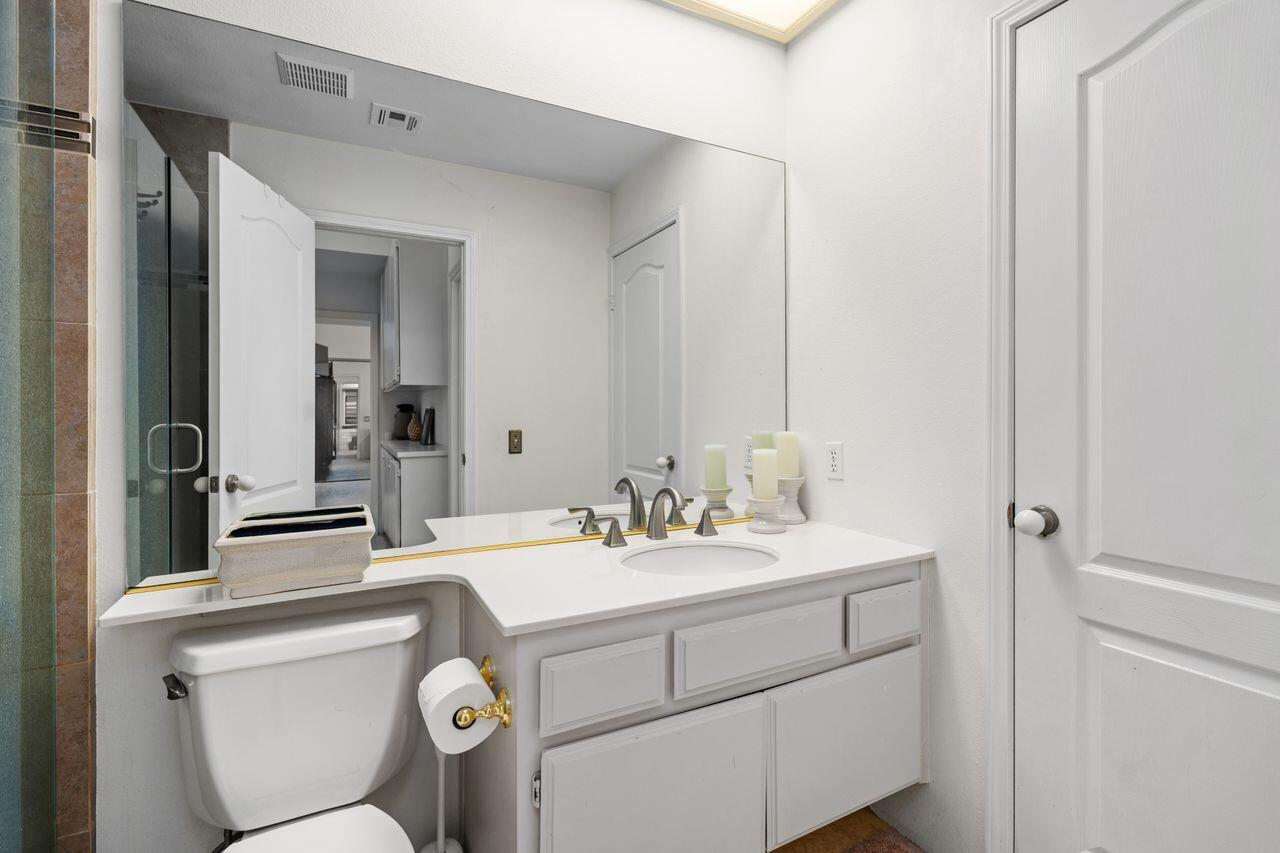6 Pebble Beach Drive Rancho Mirage, CA 92270 - Photo 22 of 44 a bathroom with a sink toilet and mirror