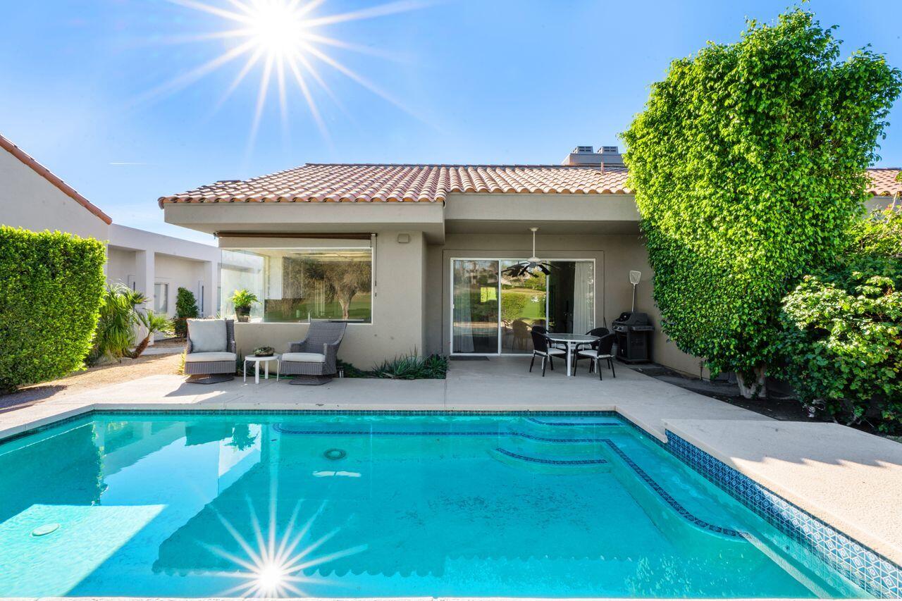 6 Pebble Beach Drive Rancho Mirage, CA 92270 - Photo 26 of 46 a backyard of a house with seating space