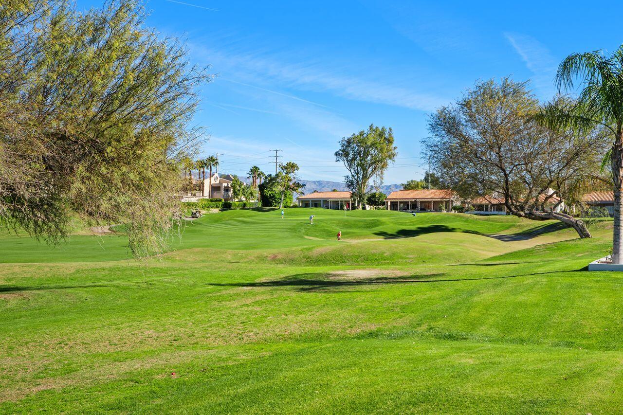 6 Pebble Beach Drive Rancho Mirage, CA 92270 - Photo 27 of 44 a view of a golf course with a big yard