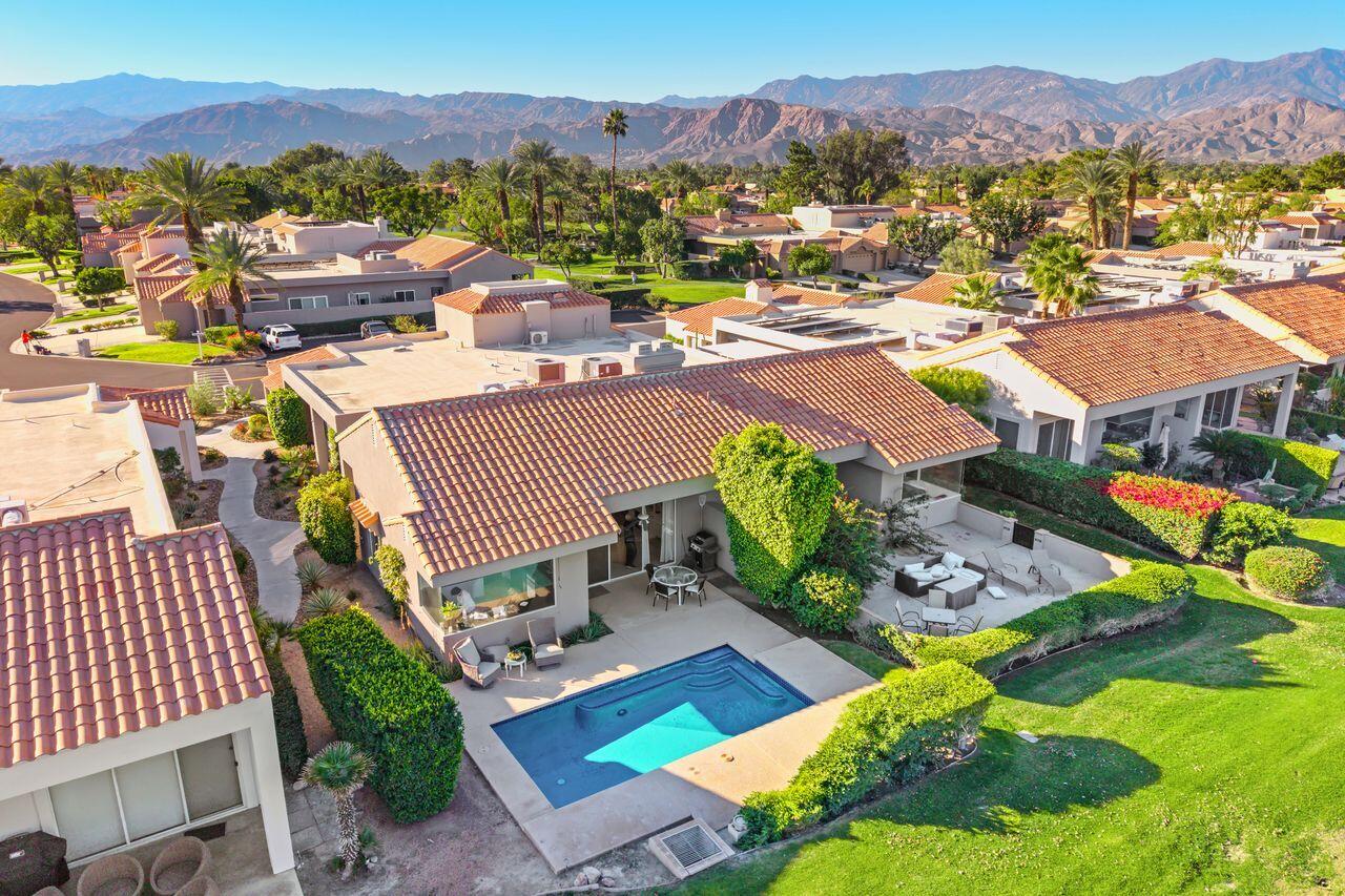 6 Pebble Beach Drive Rancho Mirage, CA 92270 - Photo 3 of 46 a view of a city from a balcony with furniture