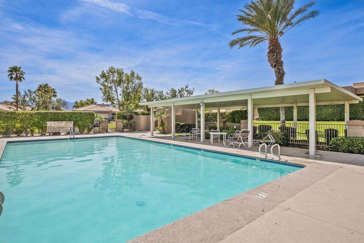 6 Pebble Beach Drive Rancho Mirage, CA 92270 - Photo 38 of 44 a view of a house with a backyard porch and sitting area