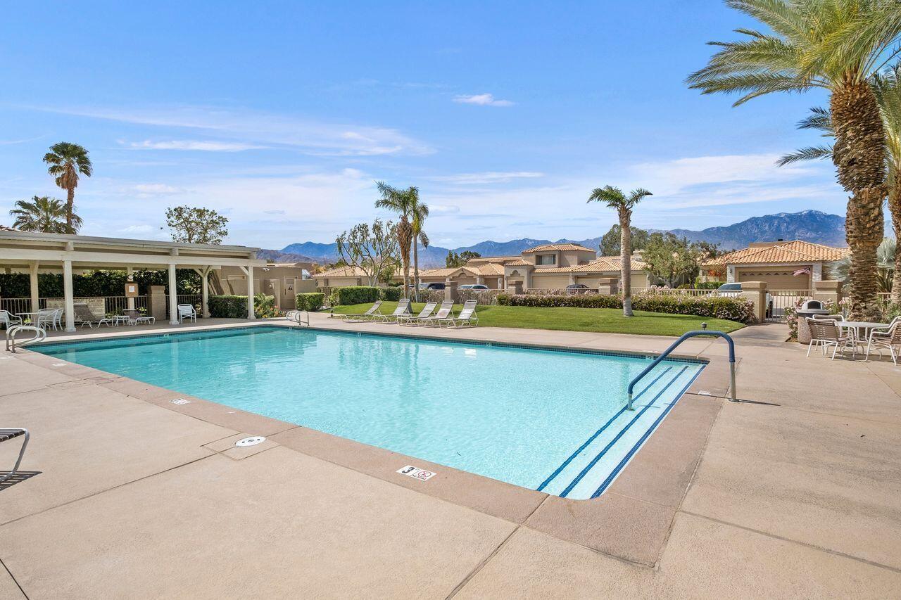 6 Pebble Beach Drive Rancho Mirage, CA 92270 - Photo 40 of 44 a view of a swimming pool with a terrace