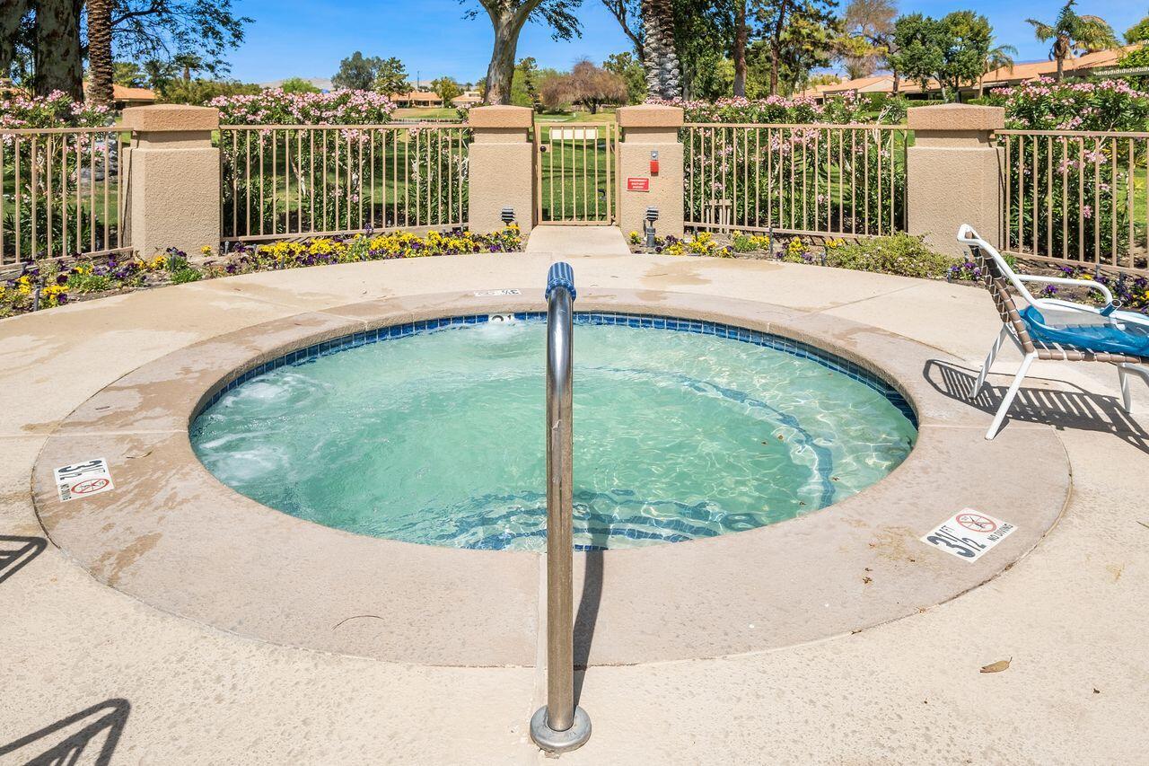 6 Pebble Beach Drive Rancho Mirage, CA 92270 - Photo 42 of 44 a view of a swimming pool with a balcony