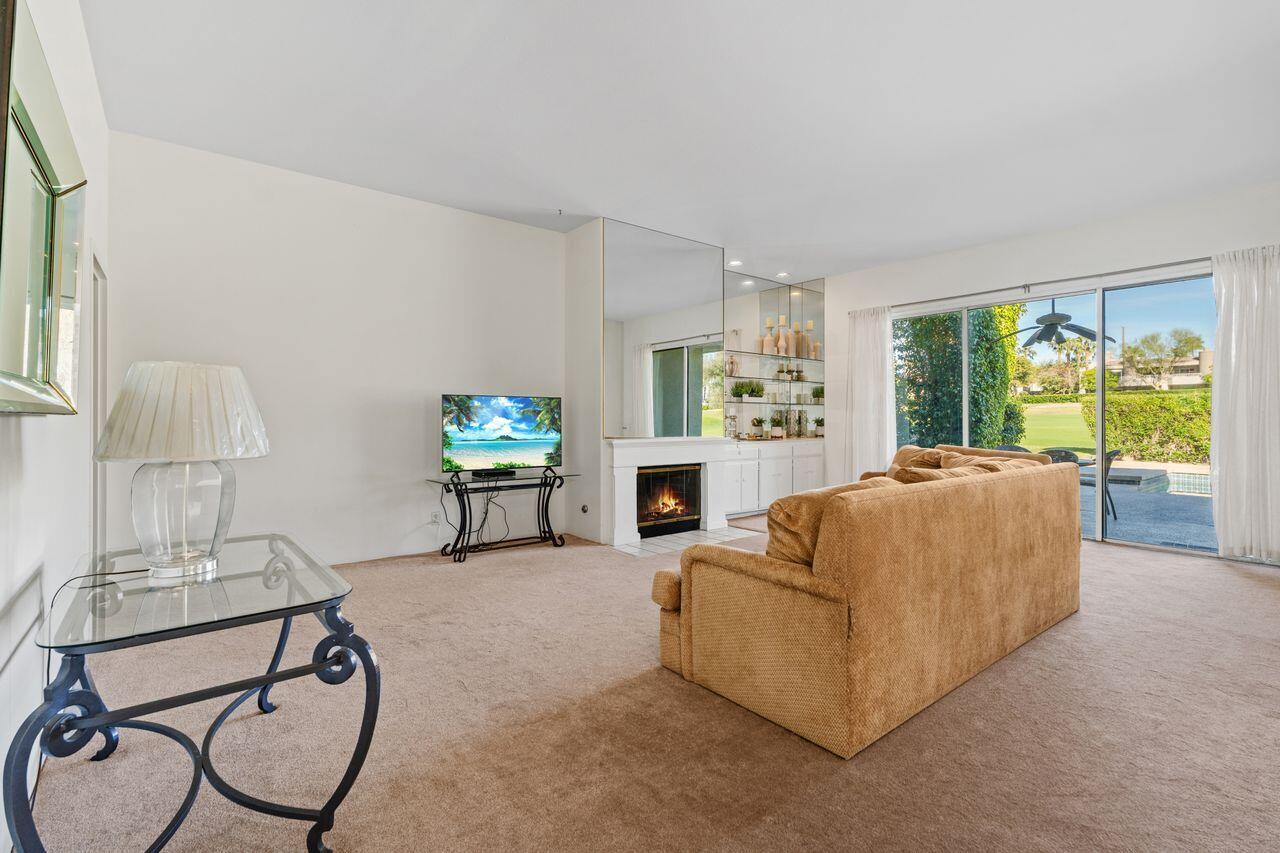 6 Pebble Beach Drive Rancho Mirage, CA 92270 - Photo 5 of 46 a living room with furniture and a flat screen tv