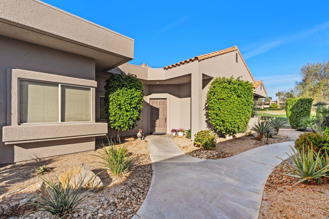 6 Pebble Beach Drive Rancho Mirage, CA 92270 - Photo 9 of 46 a front view of a house with garden