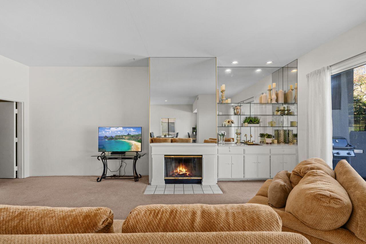6 Pebble Beach Drive Rancho Mirage, CA 92270 - Photo 10 of 46 a living room with furniture and a fireplace