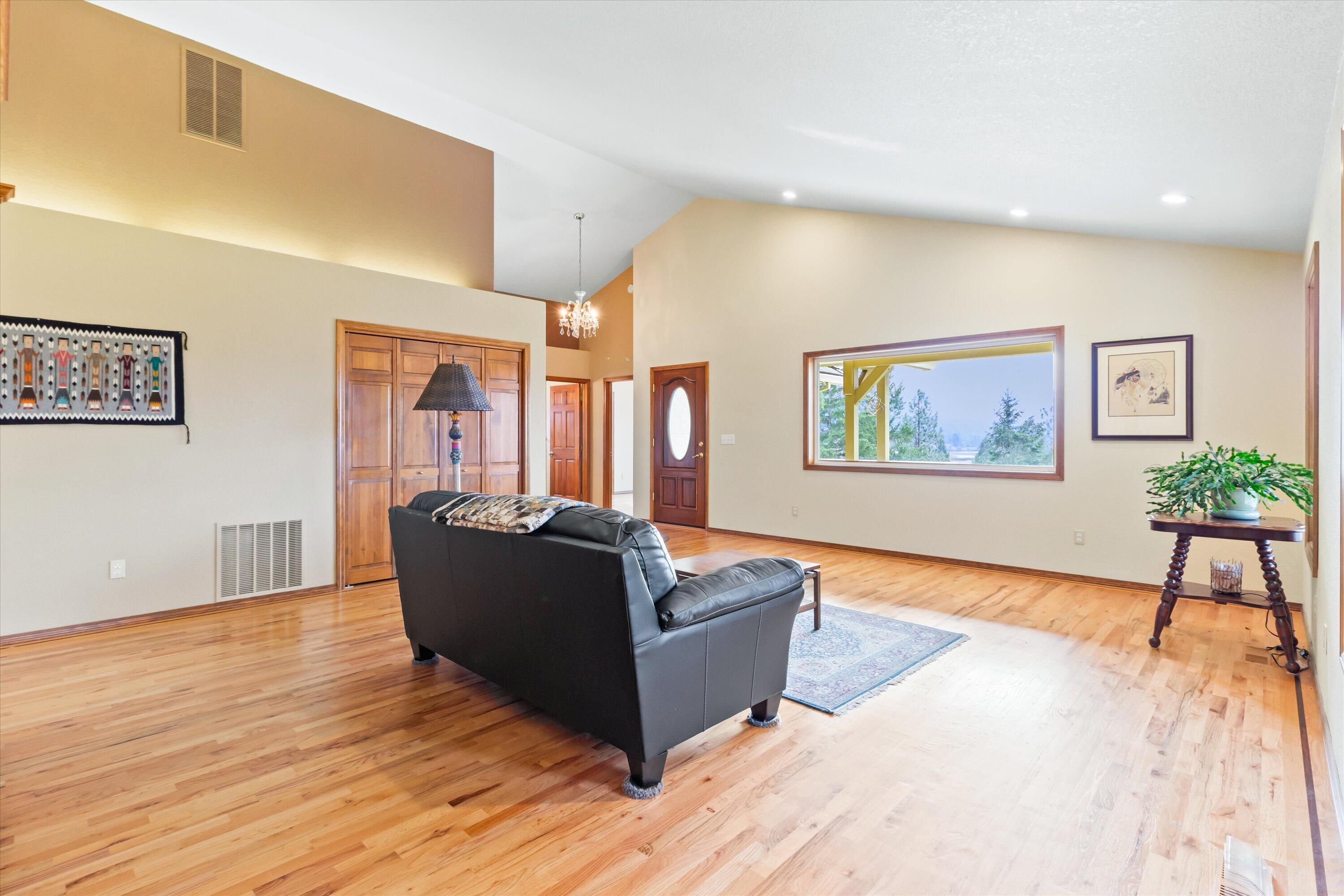 4874 Upper River Road Grants Pass, OR 97526 - Photo 14 of 66 a living room with furniture and wooden floor