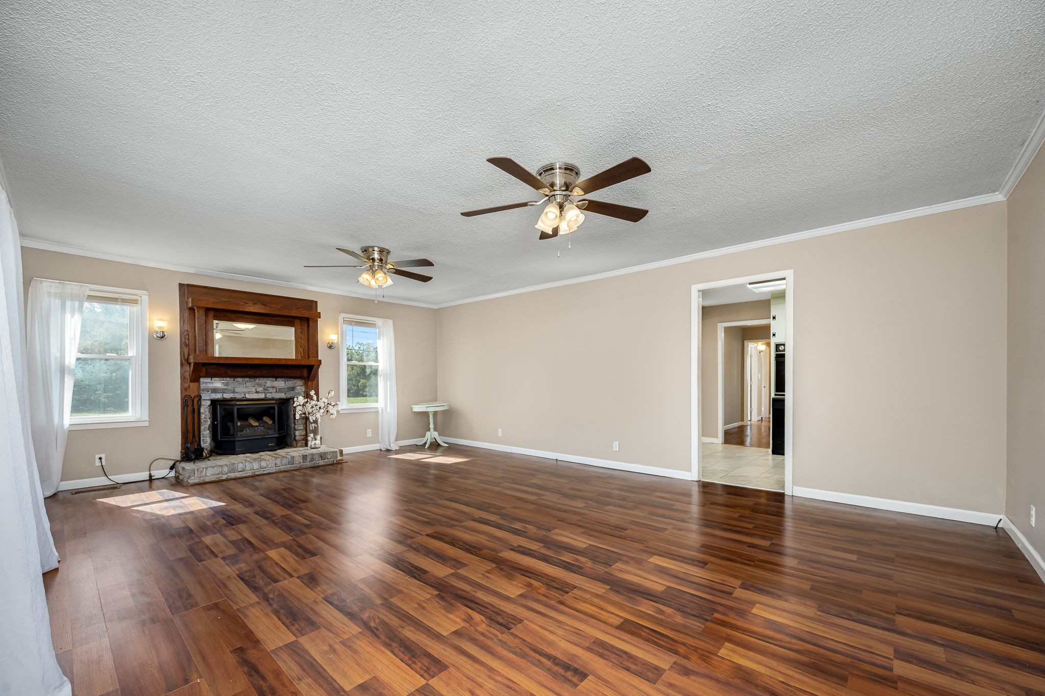 8 West Point Drive Fayetteville, TN 37334 - Photo 15 of 45 an empty room with fireplace fireplace and windows