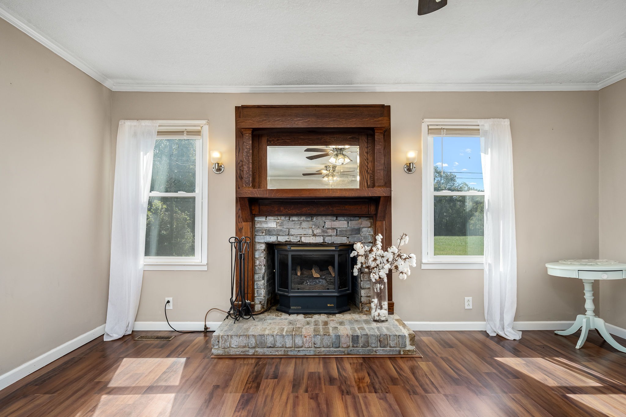 8 West Point Drive Fayetteville, TN 37334 - Photo 16 of 45 a living room with a fireplace and a wooden floor