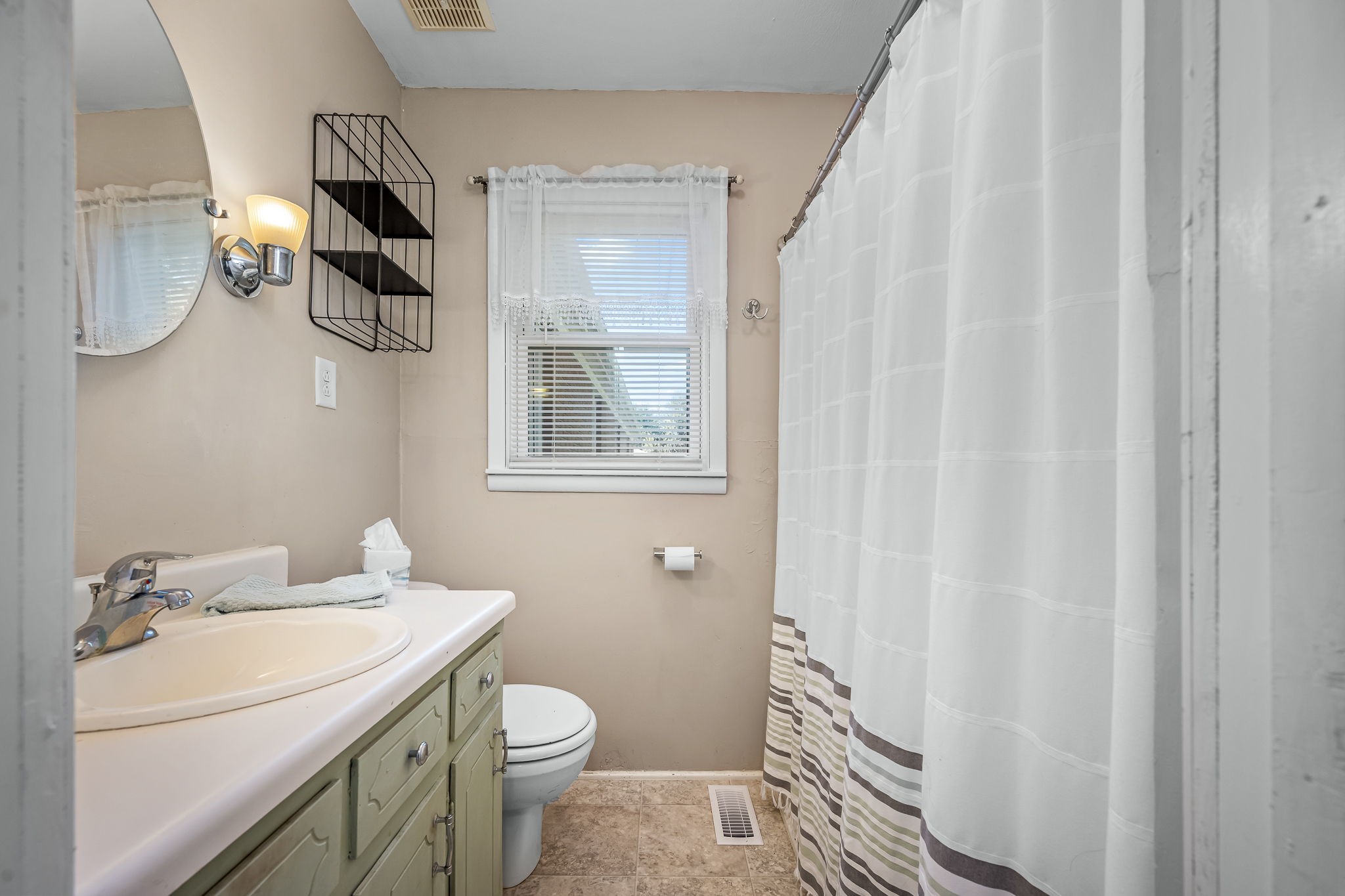 8 West Point Drive Fayetteville, TN 37334 - Photo 20 of 45 a bathroom with a sink a toilet and shower curtain