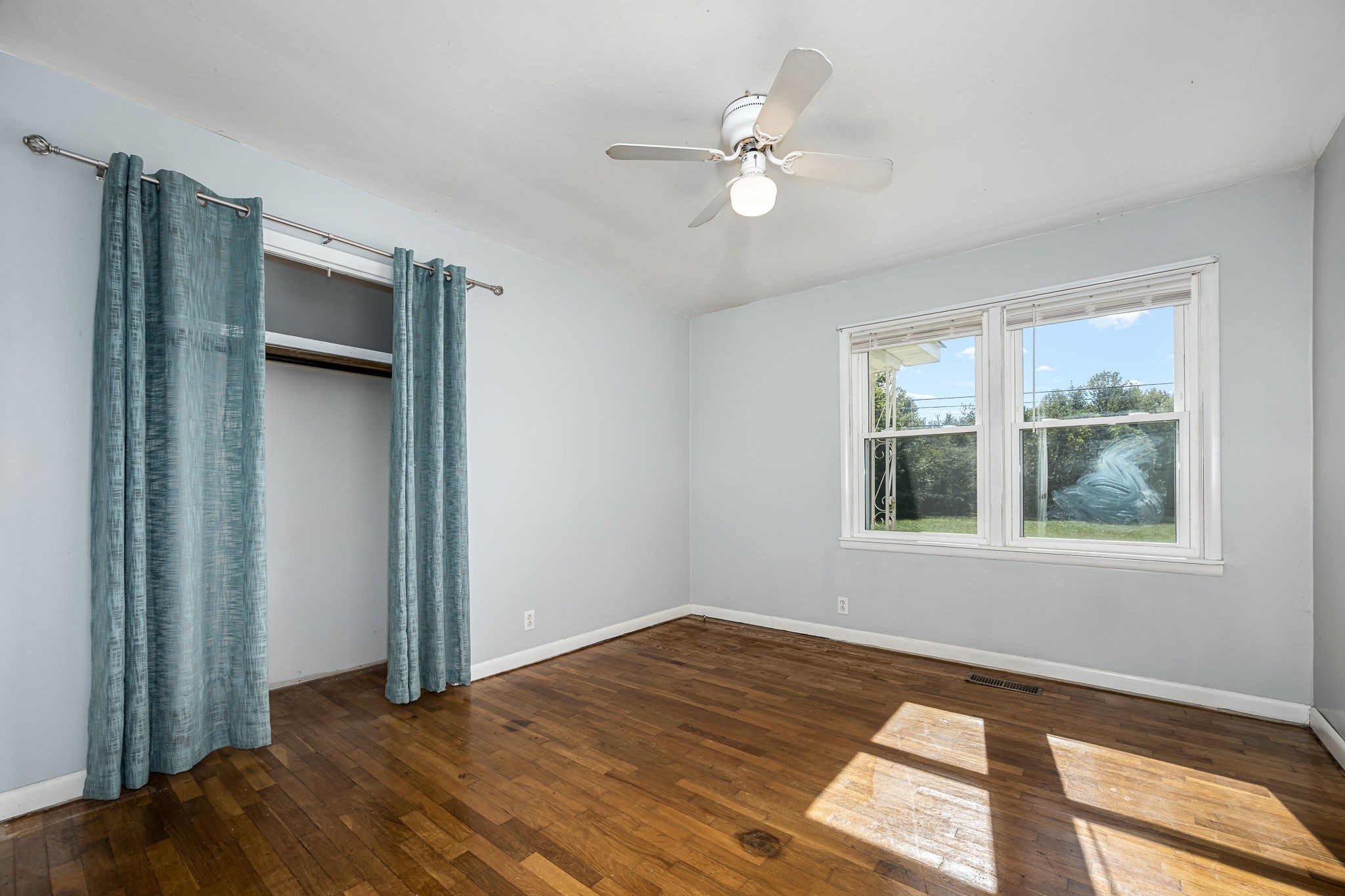 8 West Point Drive Fayetteville, TN 37334 - Photo 25 of 45 a view of an empty room with a window and wooden floor