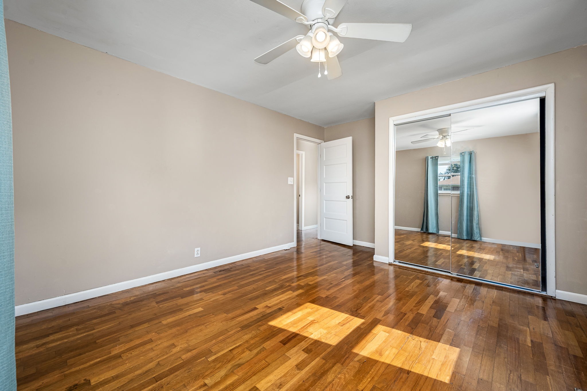 8 West Point Drive Fayetteville, TN 37334 - Photo 29 of 45 an empty room with wooden floor and fan