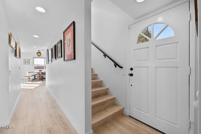 a bed room with a bed and a chair