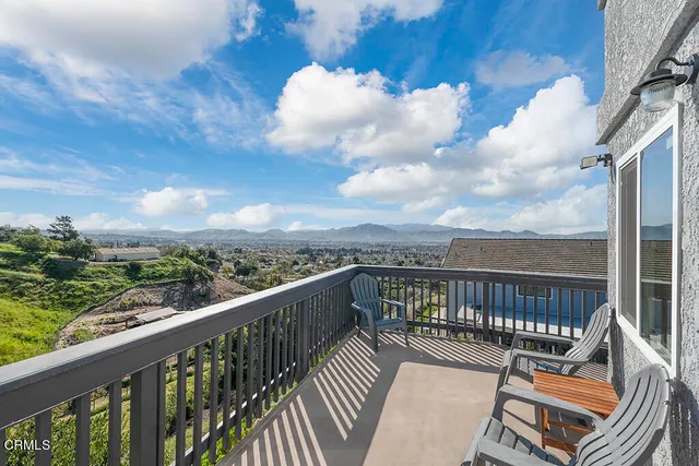 a view of a balcony with wooden floor