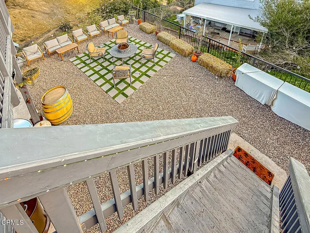 a balcony with view of outdoor space