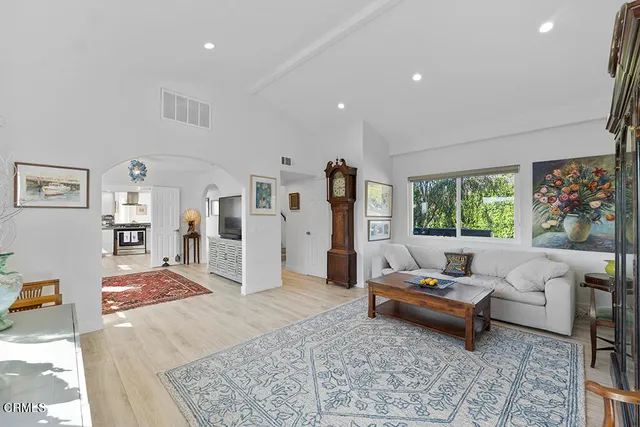 a living room with furniture and a rug