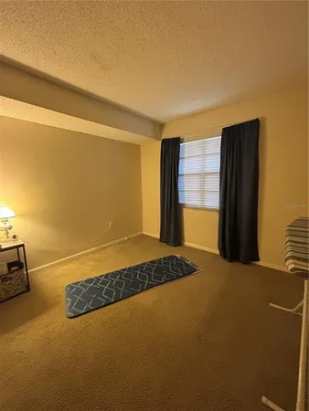 a bedroom with a bed and cabinets