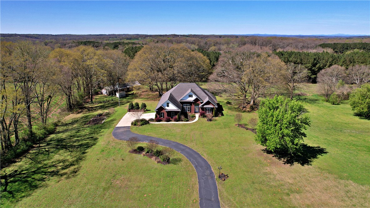 7893 Athens Road Carnesville, GA 30521 - Photo 43 of 50 Perched on a sprawling lot, this property boasts exceptional privacy and a winding driveway.