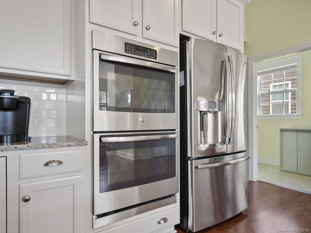 1821 Larkspur Way Tega Cay, SC 29708 - Photo 11 of 26 a kitchen with stainless steel appliances a refrigerator stove and microwave