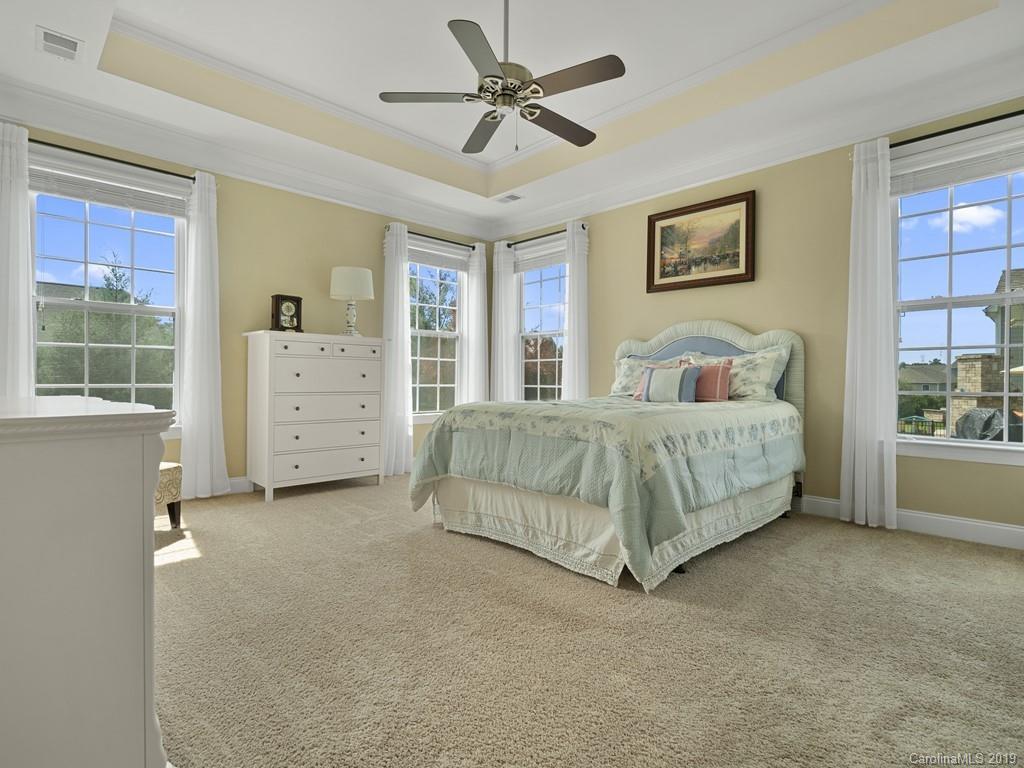 1821 Larkspur Way Tega Cay, SC 29708 - Photo 19 of 26 a bedroom with a bed and a window