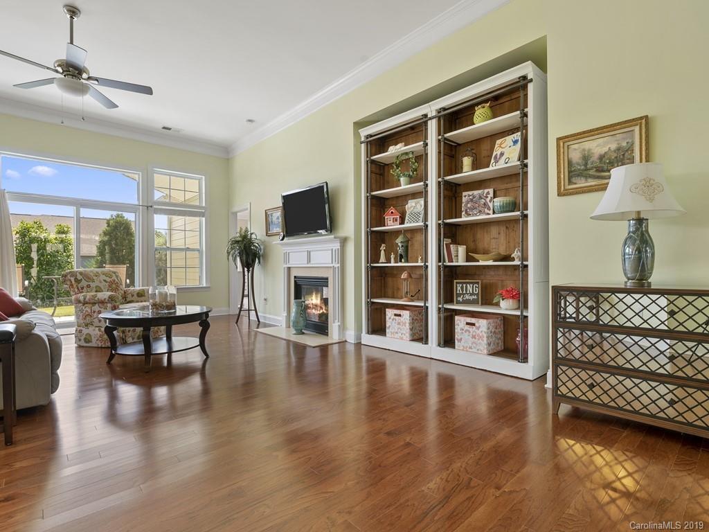 1821 Larkspur Way Tega Cay, SC 29708 - Photo 4 of 26 a living room with furniture and a fireplace