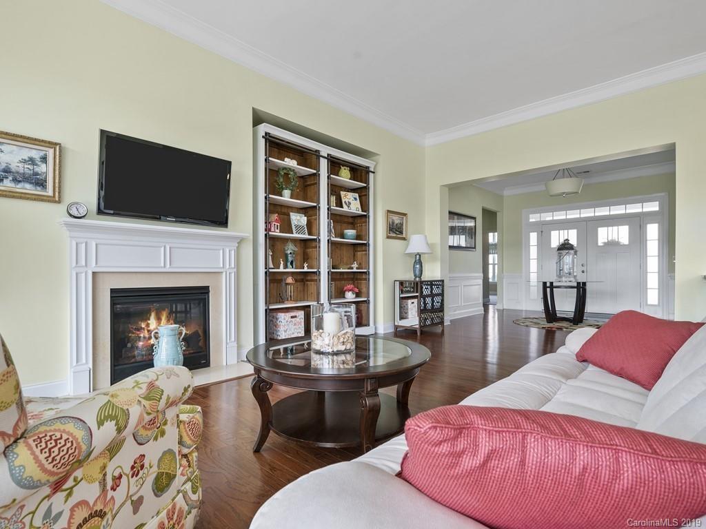 1821 Larkspur Way Tega Cay, SC 29708 - Photo 5 of 26 a living room with furniture fireplace and flat screen tv