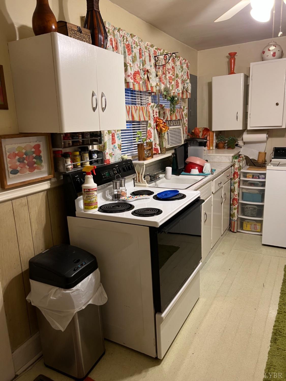 3153 Grit Road Hurt, VA 24563 - Photo 12 of 13 a kitchen with kitchen island a stove a sink and a refrigerator