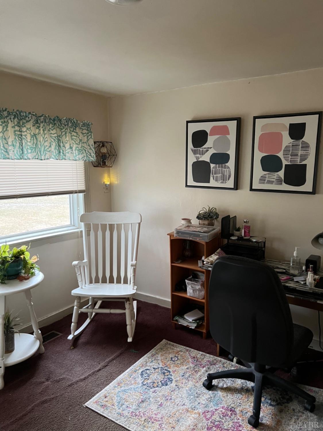 3153 Grit Road Hurt, VA 24563 - Photo 4 of 13 a view of a workspace with furniture and a window