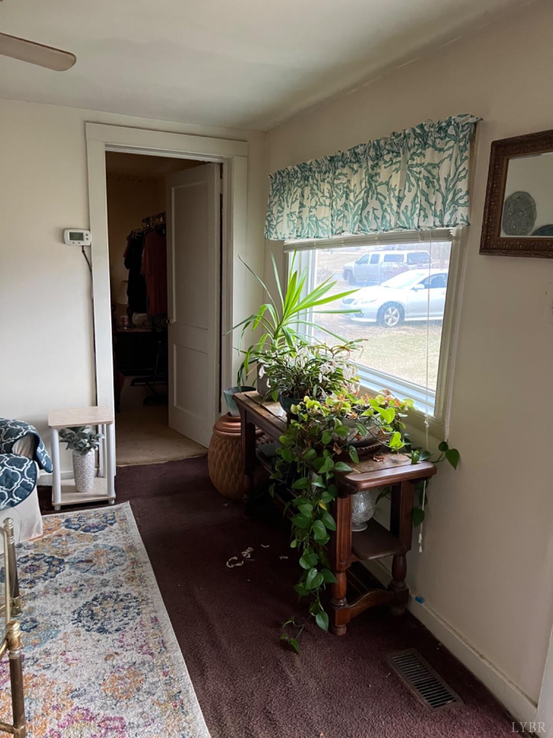 3153 Grit Road Hurt, VA 24563 - Photo 5 of 13 a living room with furniture and a potted plant