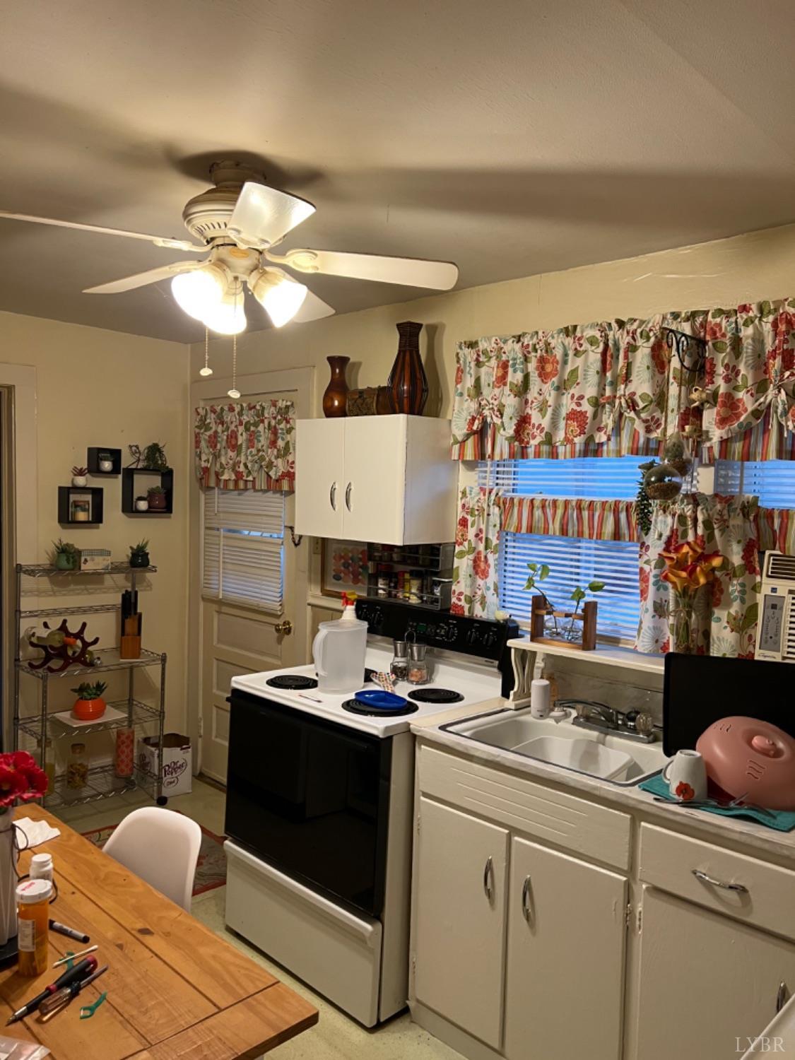 3153 Grit Road Hurt, VA 24563 - Photo 7 of 13 a kitchen with a sink cabinets and window