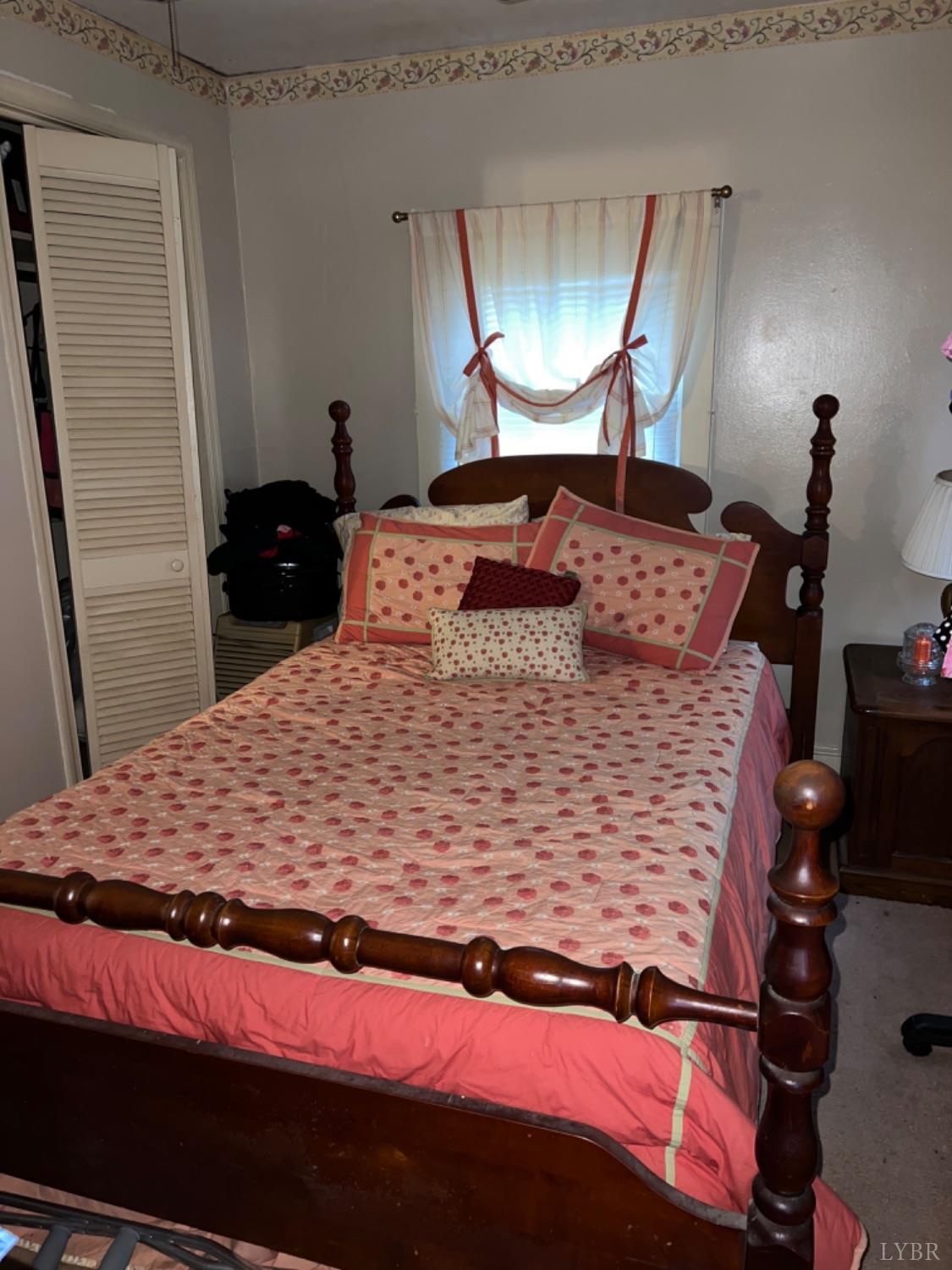 3153 Grit Road Hurt, VA 24563 - Photo 8 of 13 a bedroom with a bed and a mirror