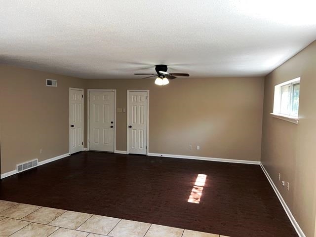 5183 Sea Shore Road Memphis, TN 38109 - Photo 3 of 17 Spare room featuring ceiling fan and light tile patterned floors